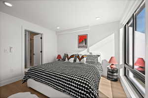 Bedroom with light wood-style flooring and recessed lighting