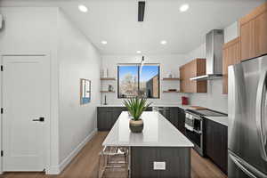Kitchen with stainless steel appliances, open shelves, modern cabinets, a kitchen island, and recessed lighting