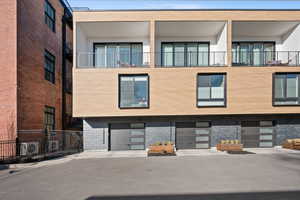 View of building exterior featuring driveway
