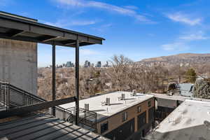 Wooden deck featuring a city view