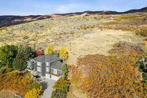 View from above of property featuring a mountainous background