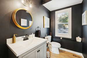 Bathroom with vanity and light wood-type flooring