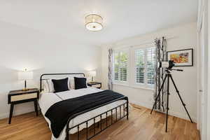 Bedroom featuring baseboards and light wood finished floors