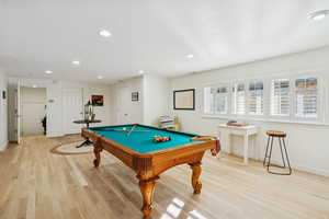 Game room with billiards, light wood-style floors, and recessed lighting