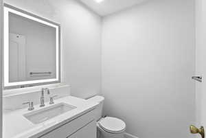 Bathroom featuring toilet and vanity