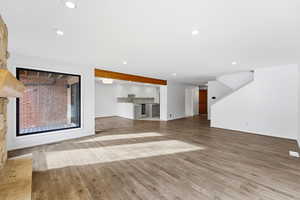 Unfurnished living room with light wood-style flooring and recessed lighting