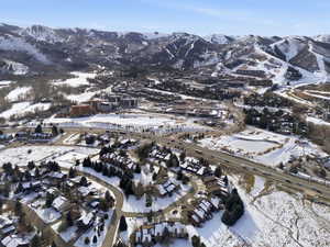 Snowy aerial view featuring a mountain view