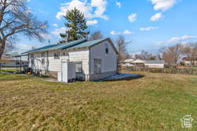 View of home's exterior with a yard
