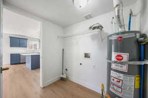 Laundry room featuring water heater, light wood-style flooring, washer hookup, and electric dryer hookup