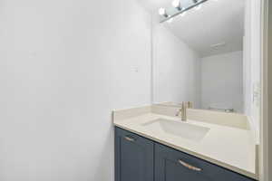 Half bath with vanity and toilet