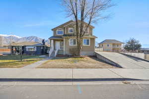 Traditional-style home with stucco siding and a mountain view