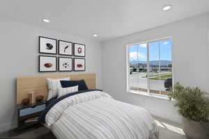 Bedroom with a mountain view and recessed lighting