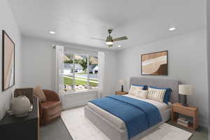 Carpeted bedroom with ceiling fan and recessed lighting