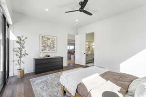 Bedroom featuring hardwood / wood-style floors, recessed lighting, ensuite bath, and a ceiling fan