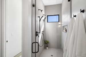 Bathroom featuring a shower stall