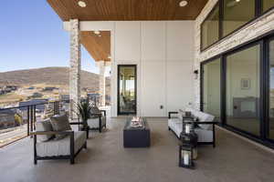 View of patio / terrace with a mountain view and outdoor lounge area