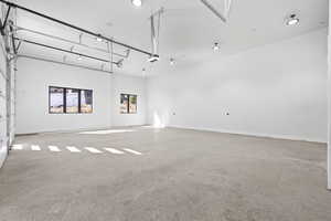 Empty room featuring light colored carpet