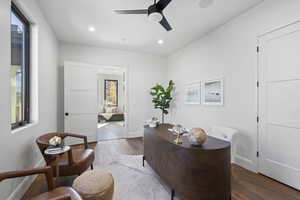 Office area featuring hardwood / wood-style floors, a ceiling fan, and recessed lighting