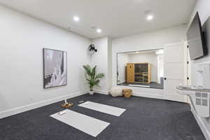 Workout room with a sauna / steam room, recessed lighting, and carpet
