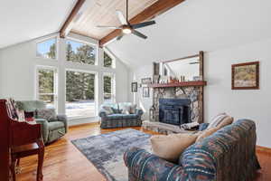 Living room featuring light wood-style flooring and ceiling fan