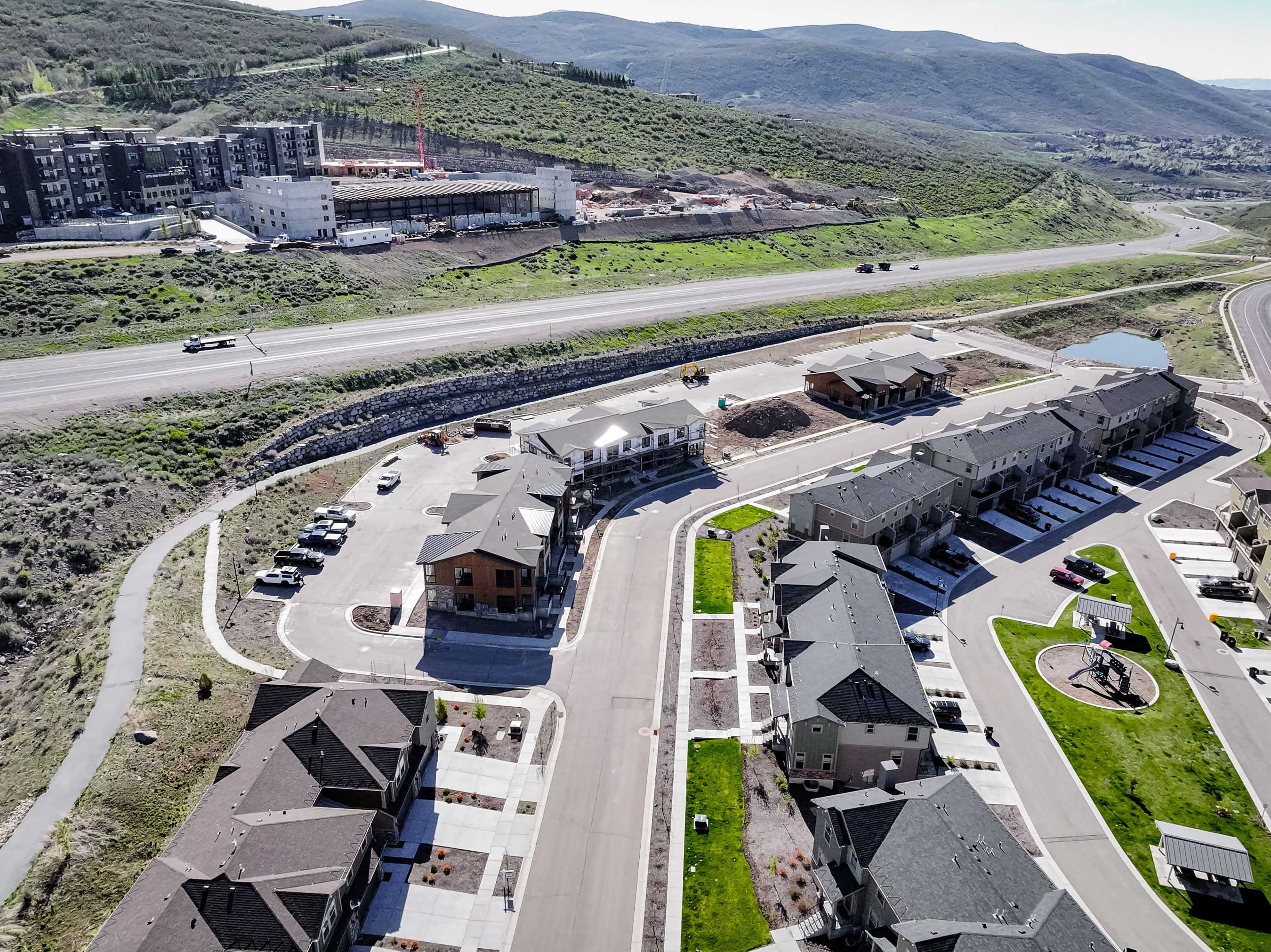 Aerial view of property and surrounding area with a mountainous background