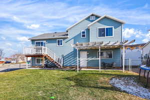 Back of property with a patio area, a fenced backyard, a trampoline, and a pergola