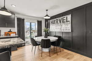 Dining area with light wood finished floors