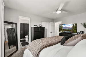 Carpeted bedroom featuring a ceiling fan, a textured ceiling, a closet, and connected bathroom