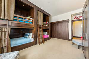 Bedroom with carpet and baseboards