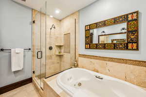 Full bath with a whirlpool tub, a shower stall, tile patterned flooring, and recessed lighting