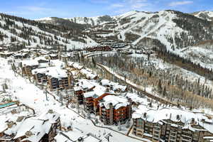 Snowy aerial view with a mountain view