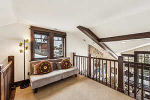 Sitting room featuring an upstairs landing