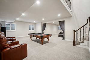 Rec room featuring light colored carpet, recessed lighting, and pool table