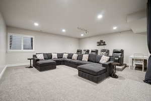 Cinema featuring recessed lighting and light carpet