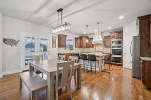 Dining area featuring light wood-style flooring and recessed lighting