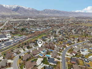 Aerial overview of property's location featuring nearby suburban area and mountains
