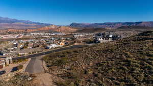 Aerial perspective of suburban area featuring a mountainous background