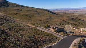 Aerial overview of property's location featuring a mountainous background