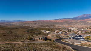 Aerial view of residential area featuring a mountain backdrop
