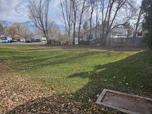 View of yard featuring a residential view and a mountain view