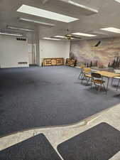Misc room featuring a skylight and a textured ceiling
