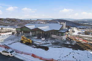 View of front facade with a chimney and a mountain view