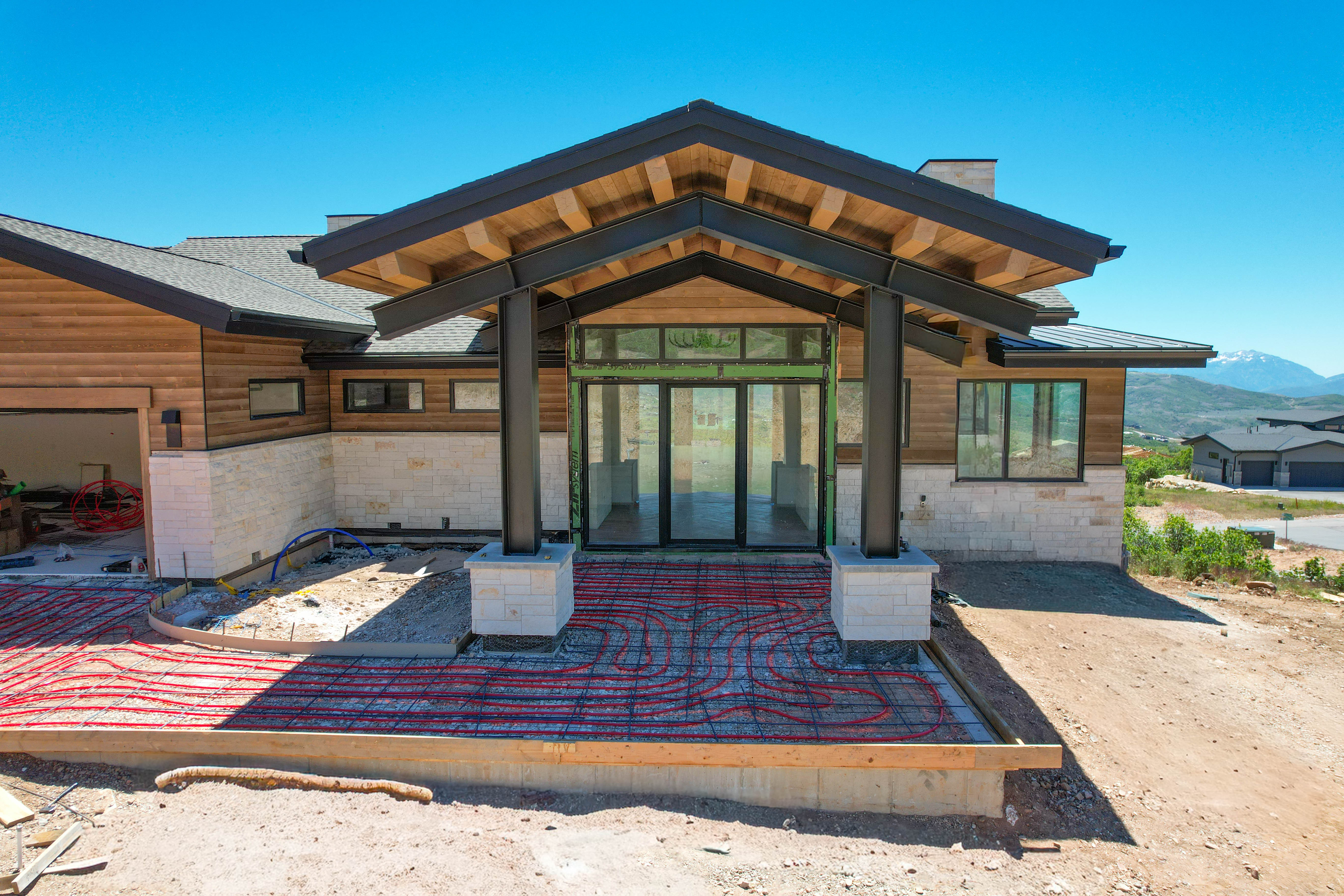 Contemporary architectural design featuring a wood-clad and stone exterior