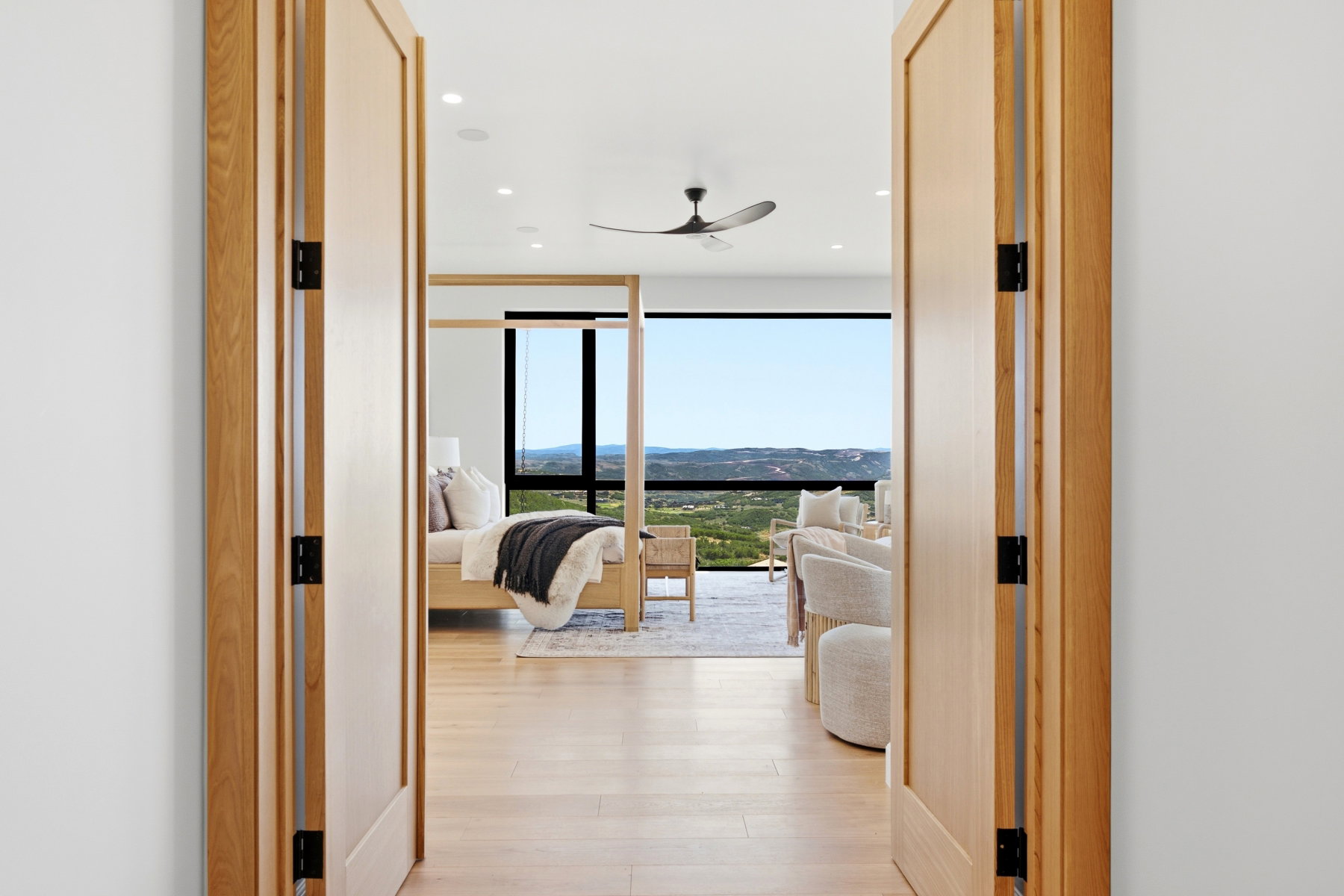 Wide plank wood-finish flooring extends throughout this expansive interior space