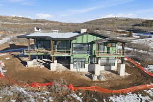 Exterior space featuring a mountain view and a chimney
