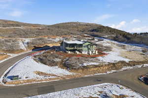 Snowy aerial view with a mountain view