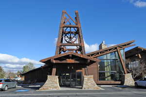 View of building exterior featuring uncovered parking
