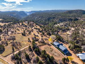 Aerial overview of property's location featuring a mountain backdrop