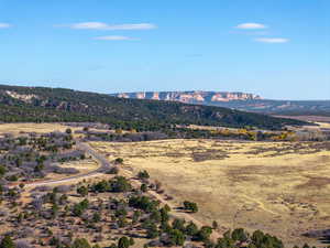 View of mountain background featuring rural landscape