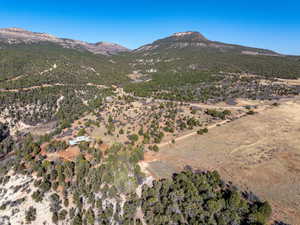 Aerial overview of property's location with mountains and rural landscape